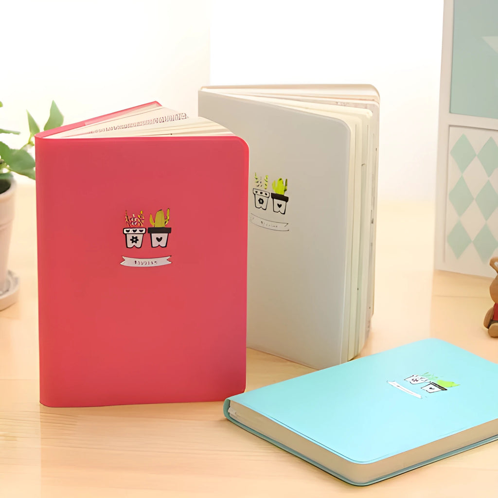 Leather A5 notebook with elastic strap closure showing beige paper pages in blue cover option
