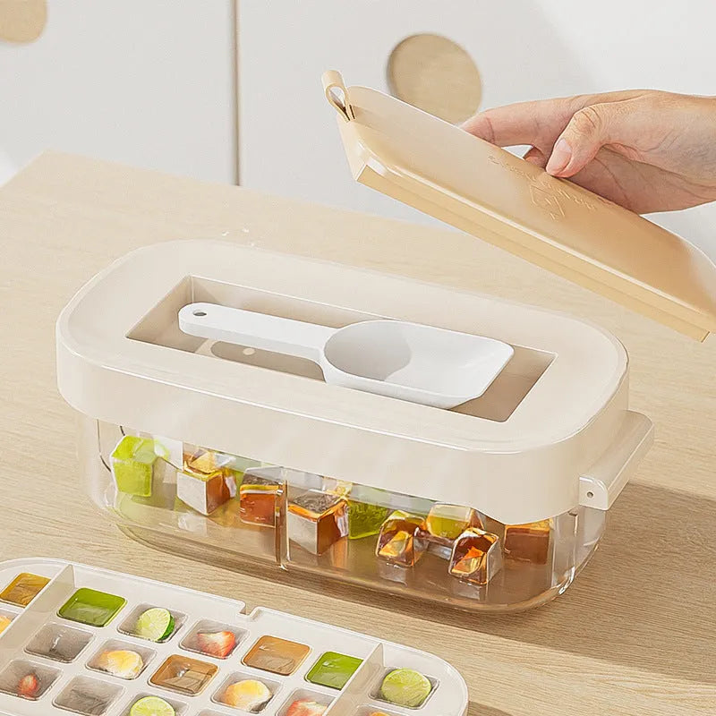 Food-grade ice cube tray in blue with leverage mechanism and integrated shovel storage