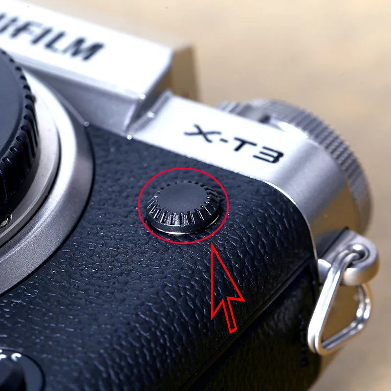 Black plastic camera shutter button with 1cm diameter for mechanical shutter replacement