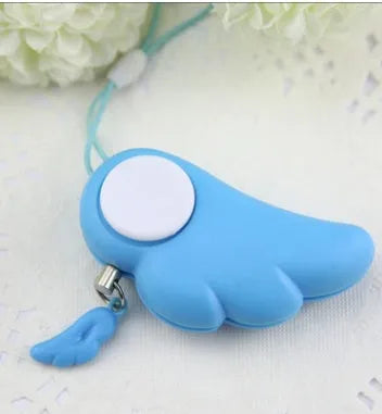 Blue personal security alarm clipped to a handbag strap, compact size 6cm x 3cm