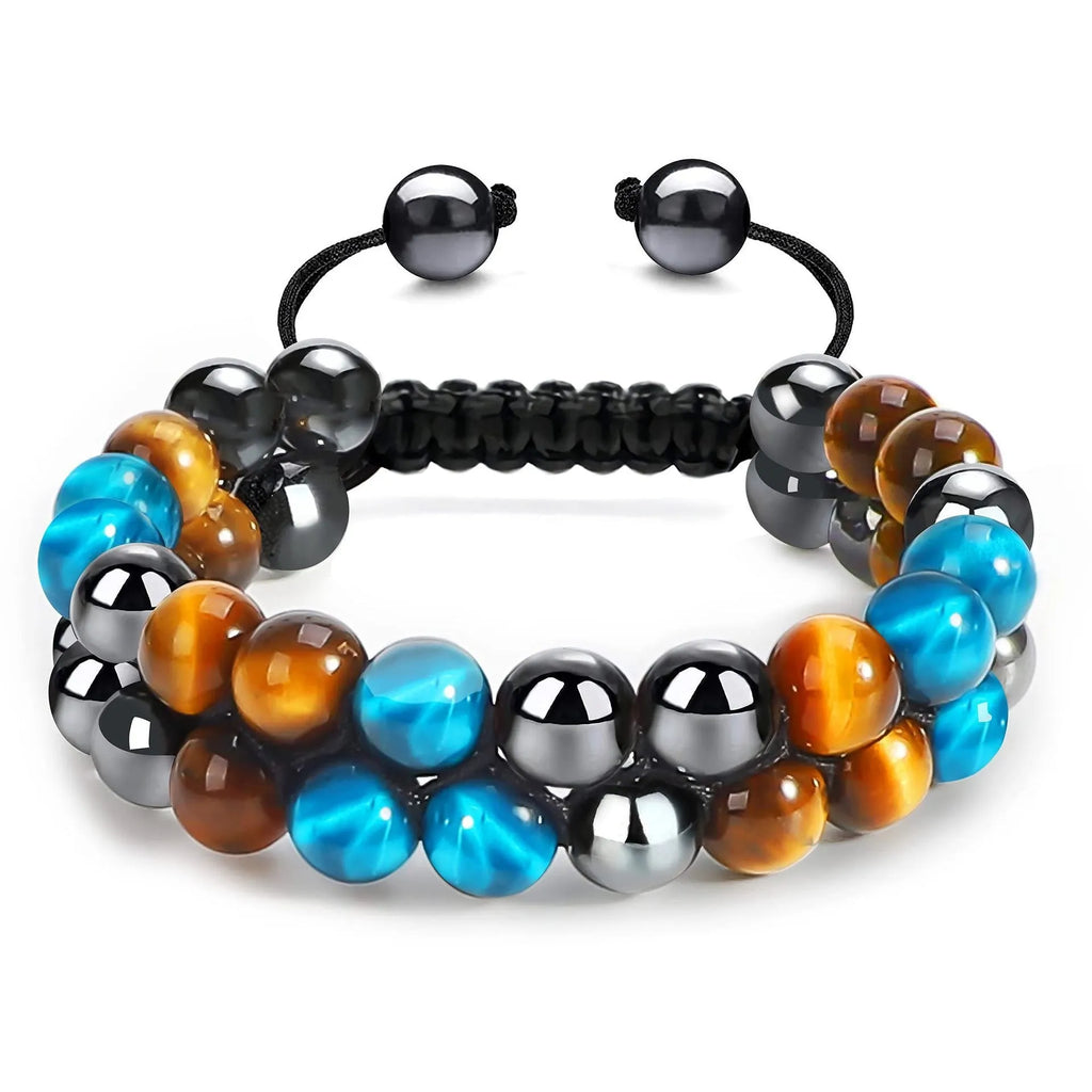 Close-up of a unisex alloy bracelet featuring green cat's eye tiger eye stones and red iron stone with an auspicious elephant charm.