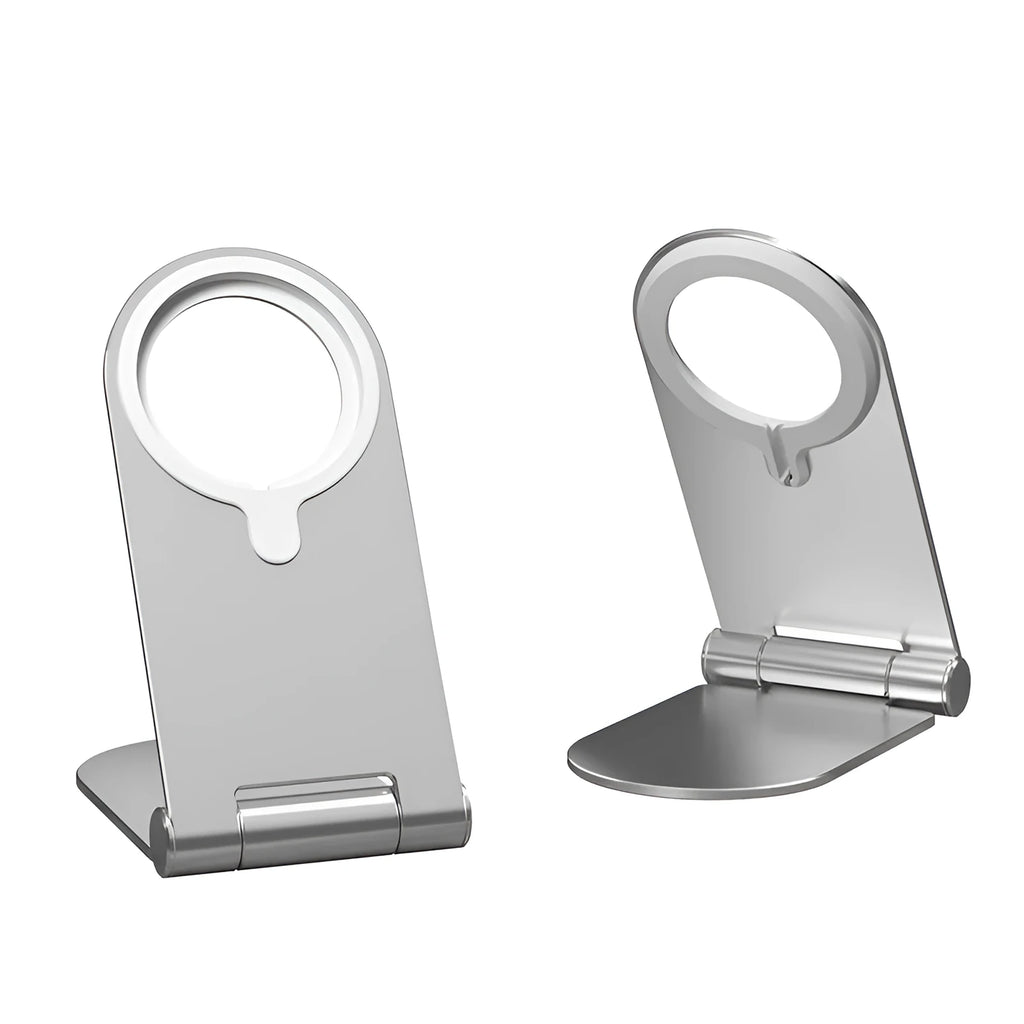 Silver aluminium alloy and plastic magnetic phone bracket for iPhone 12 on a desk.
