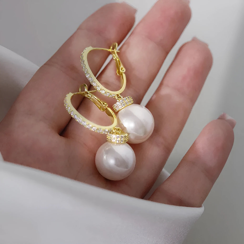 Yellow gold copper earrings with imitation pearl and inlaid zircon in geometric round shape