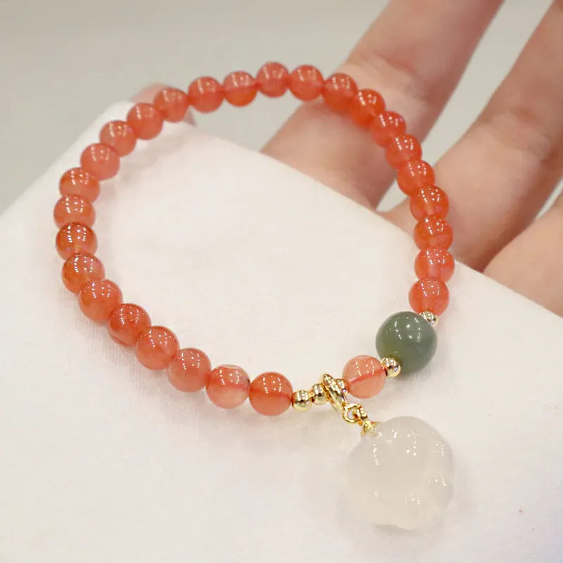 Women's bracelet with 8mm red agate cat's paw beads on a 6mm band.