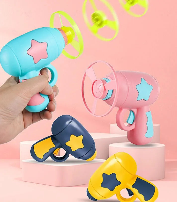Blue LED flying saucer launcher toy set with gun, three luminous discs, and target board on packaging.