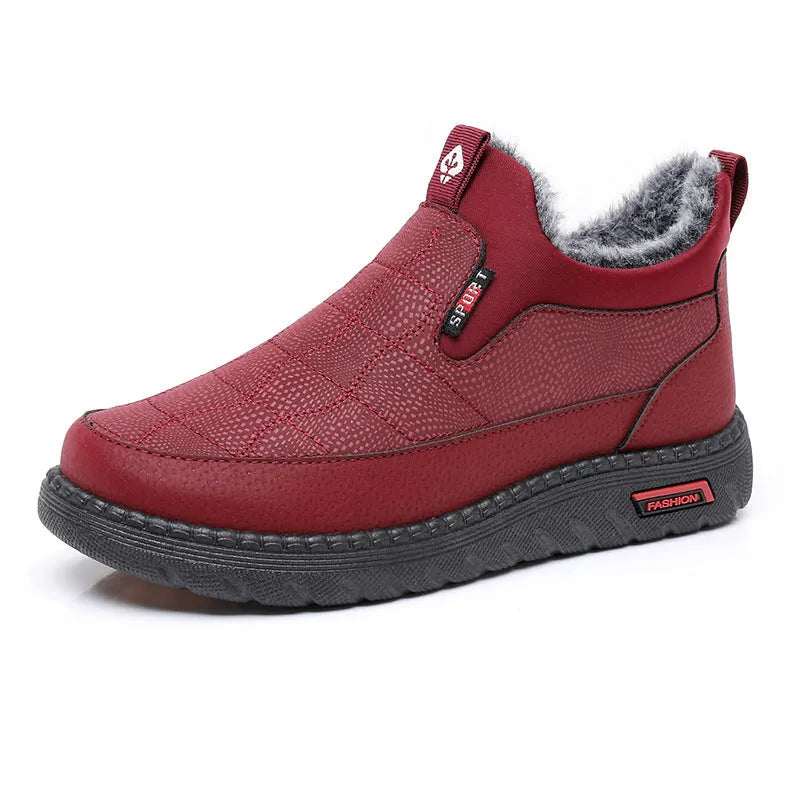 Women's black flat casual ankle boots with round toe and synthetic leather upper