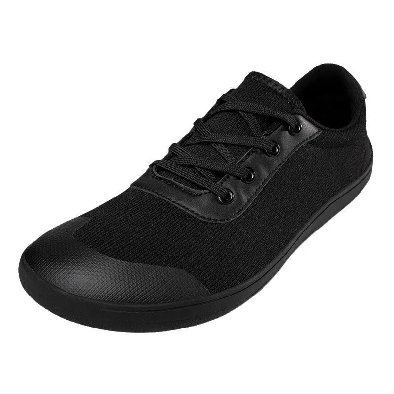 Men's solid-colour training shoes with a mesh upper, wide fit, and ribbed non-slip sole.