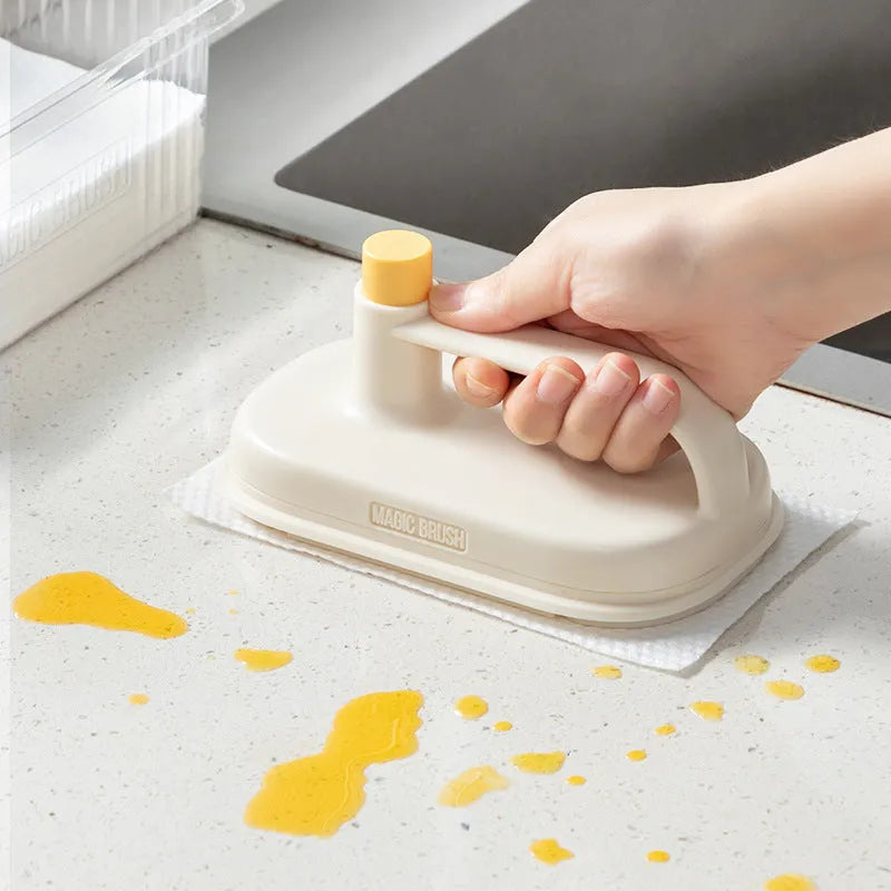 Disposable Magic Cleaning Brush with plastic handle and a pack of 50 white non-woven replacement rags.