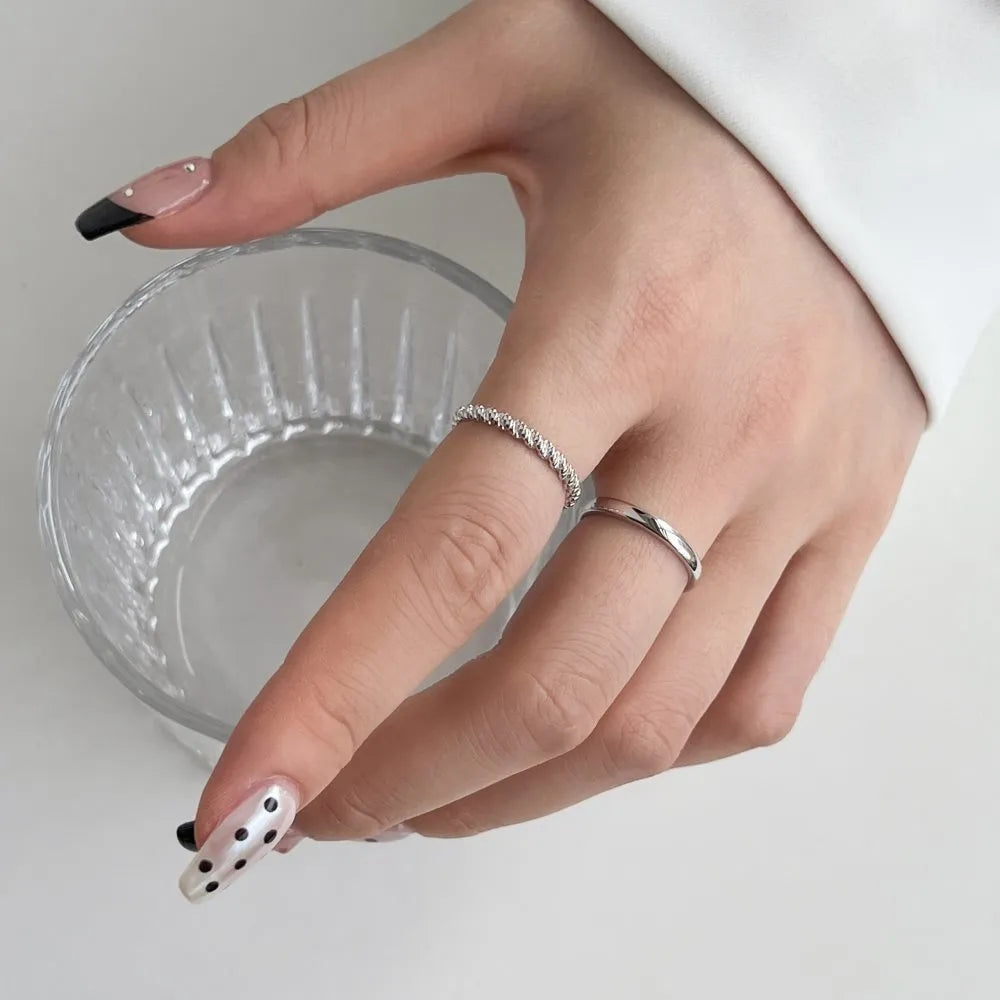 S925 sterling silver ring with geometric twist design in white gold colour finish