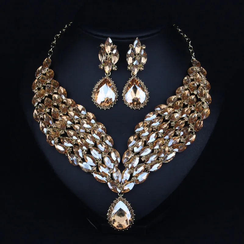 Full drill bridal clavicle chain necklace set with matching accessories in champagne and green on white background