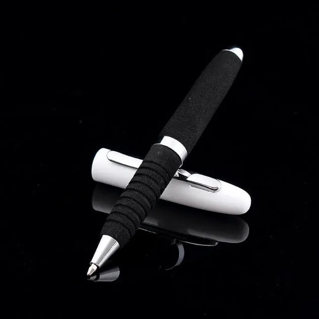 Silver EVA metal cap ballpoint pen with a 1.0mm tip on a notepad.