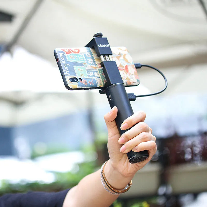 Black aluminium alloy portable power bank with a carry handle, showing compact size