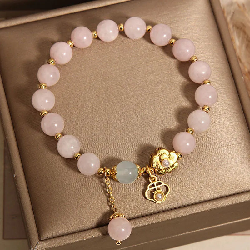 Women's pink crystal flower charm bracelet with delicate floral design