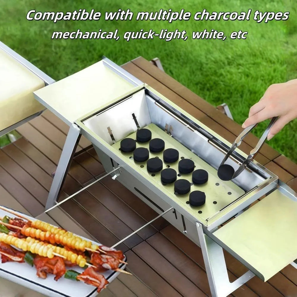 Small foldable portable charcoal grill shown in an outdoor setting.