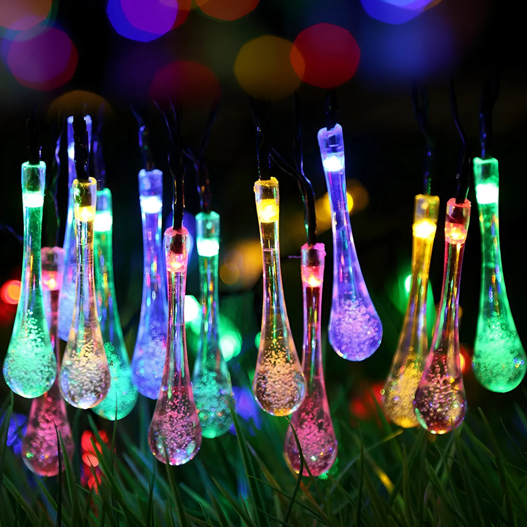 String of solar-powered LED garden lights with water drop-shaped pendants on a 6.5 metre cable.
