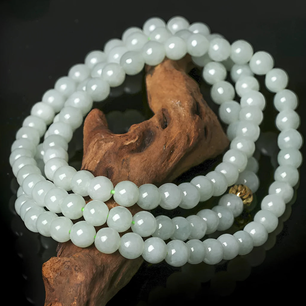 Natural A-level jade bead necklace with white and green round beads on an adjustable chain.