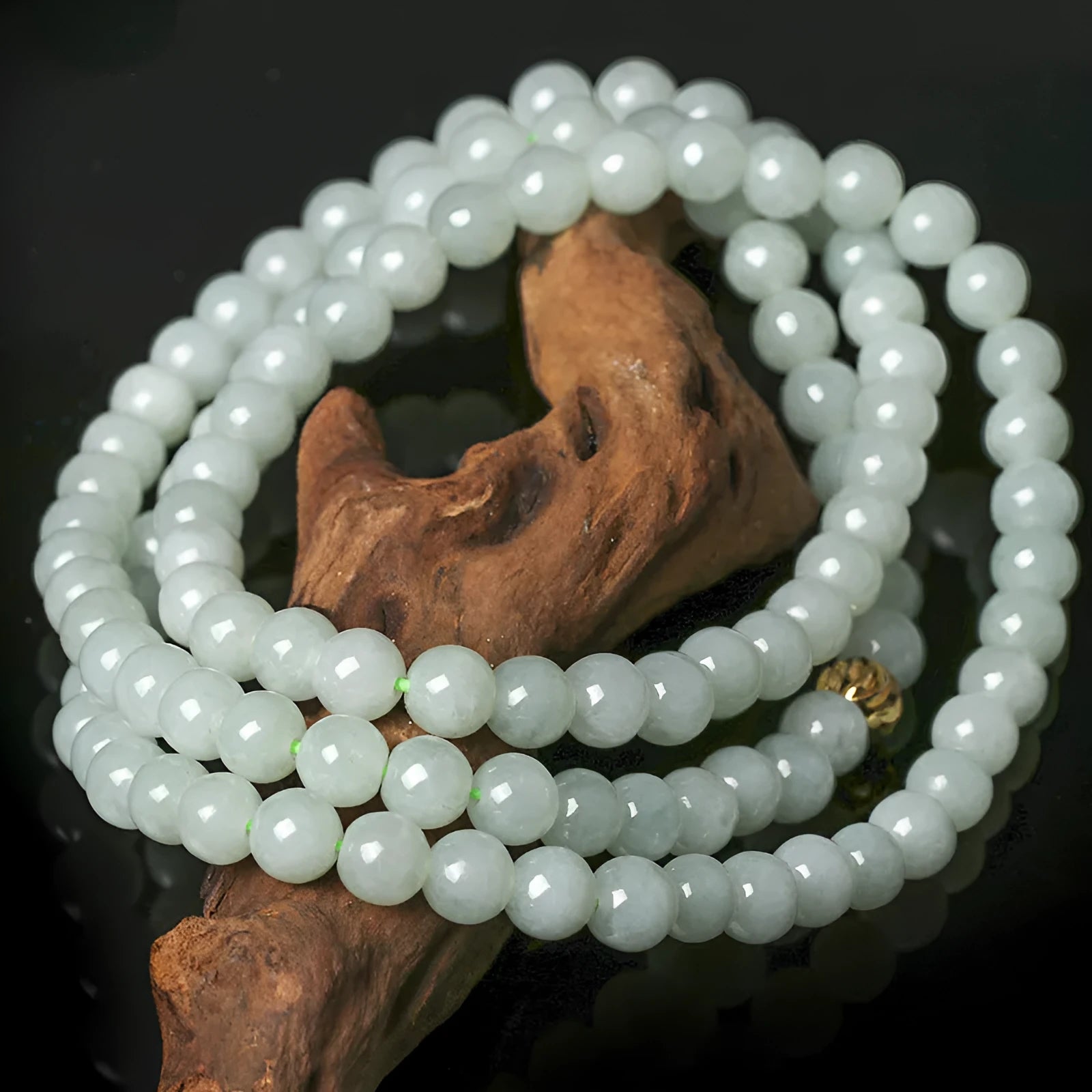 Natural A-level jade bead necklace with white and green round beads on an adjustable chain.