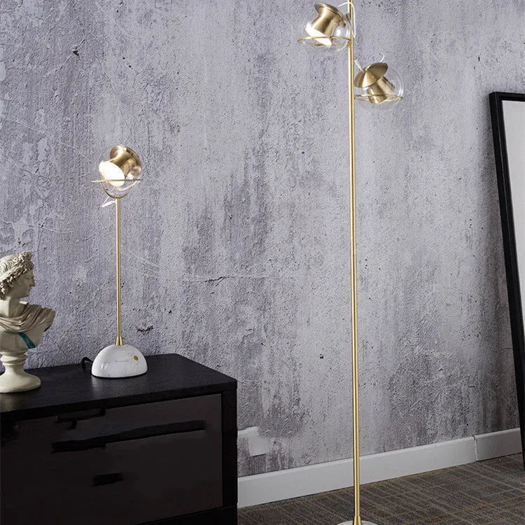 Dimmable touch-controlled desk lamp with glass shade on wooden desk