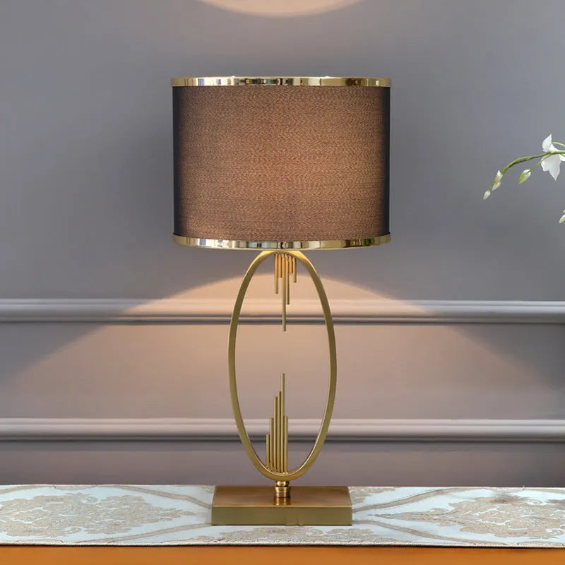White single gilt-edged Nordic bedside lamp on wooden table, trumpet shade, diameter 30cm height 58cm