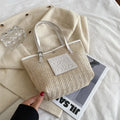 Women's woven straw shoulder bag with large capacity showing European retro styling and three-dimensional pocket