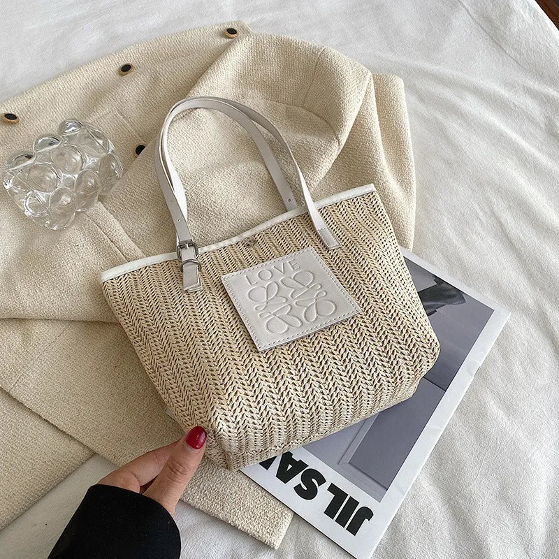 Women's woven straw shoulder bag with large capacity showing European retro styling and three-dimensional pocket