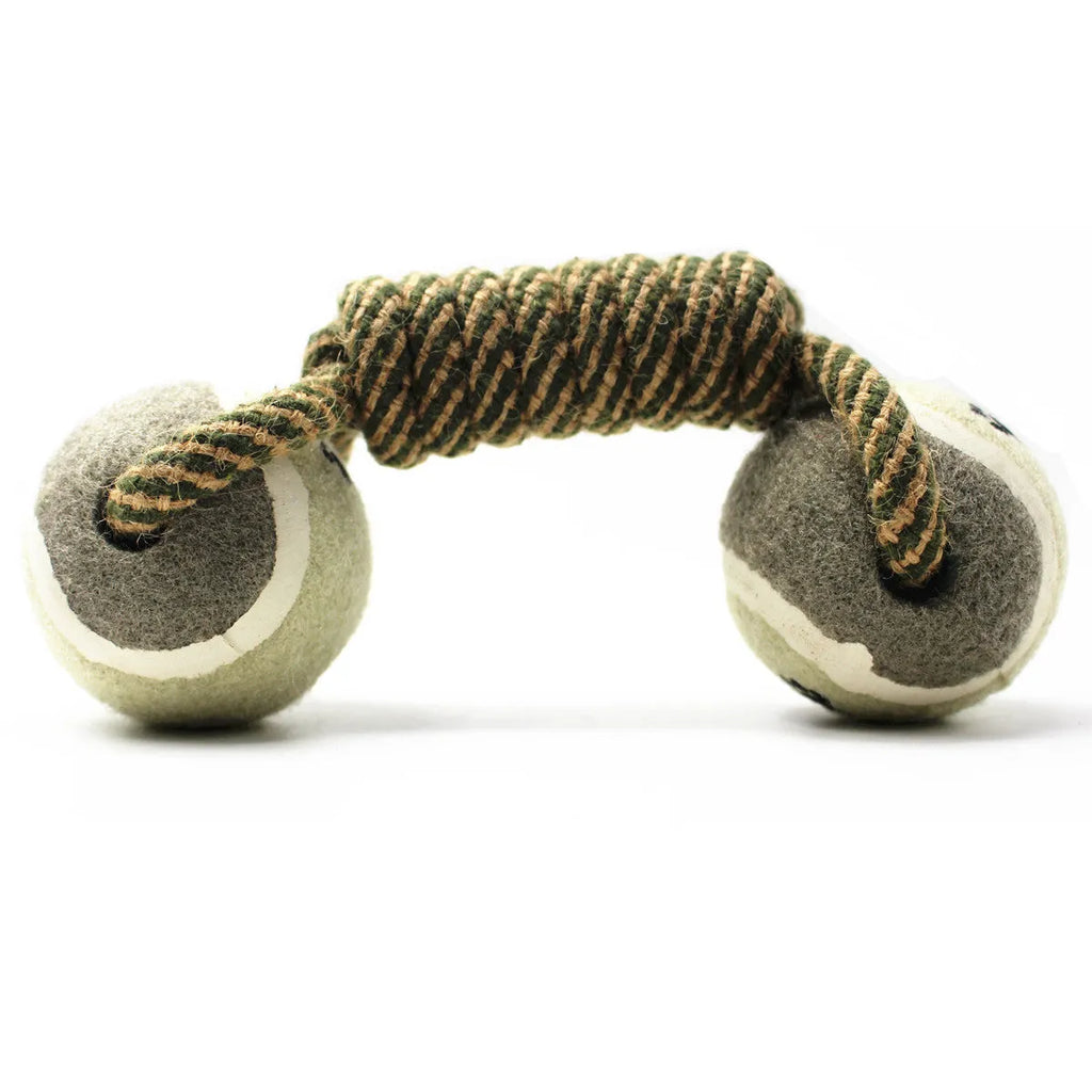 Cotton braided rope dumbbell dog toy with two tennis ball knots on a white background