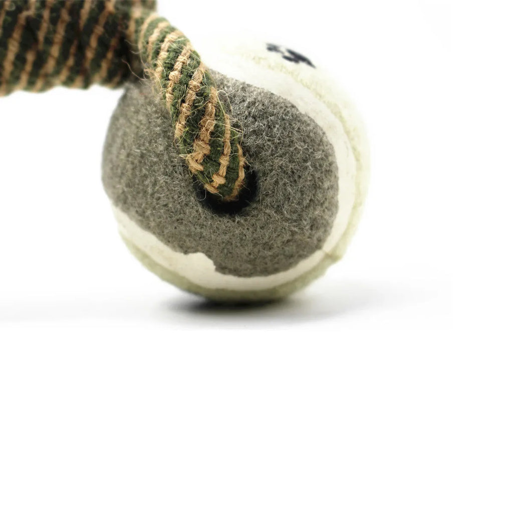Cotton braided rope dumbbell dog toy with two tennis ball knots on a white background