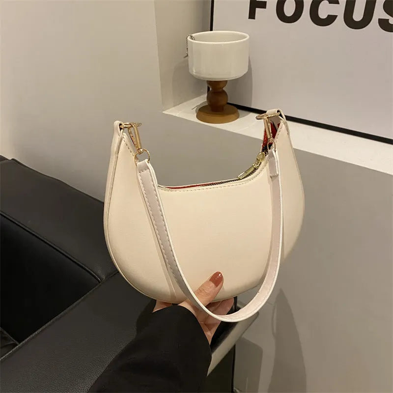 Round green PU leather one-shoulder underarm bag with sewing line details and a shoulder strap