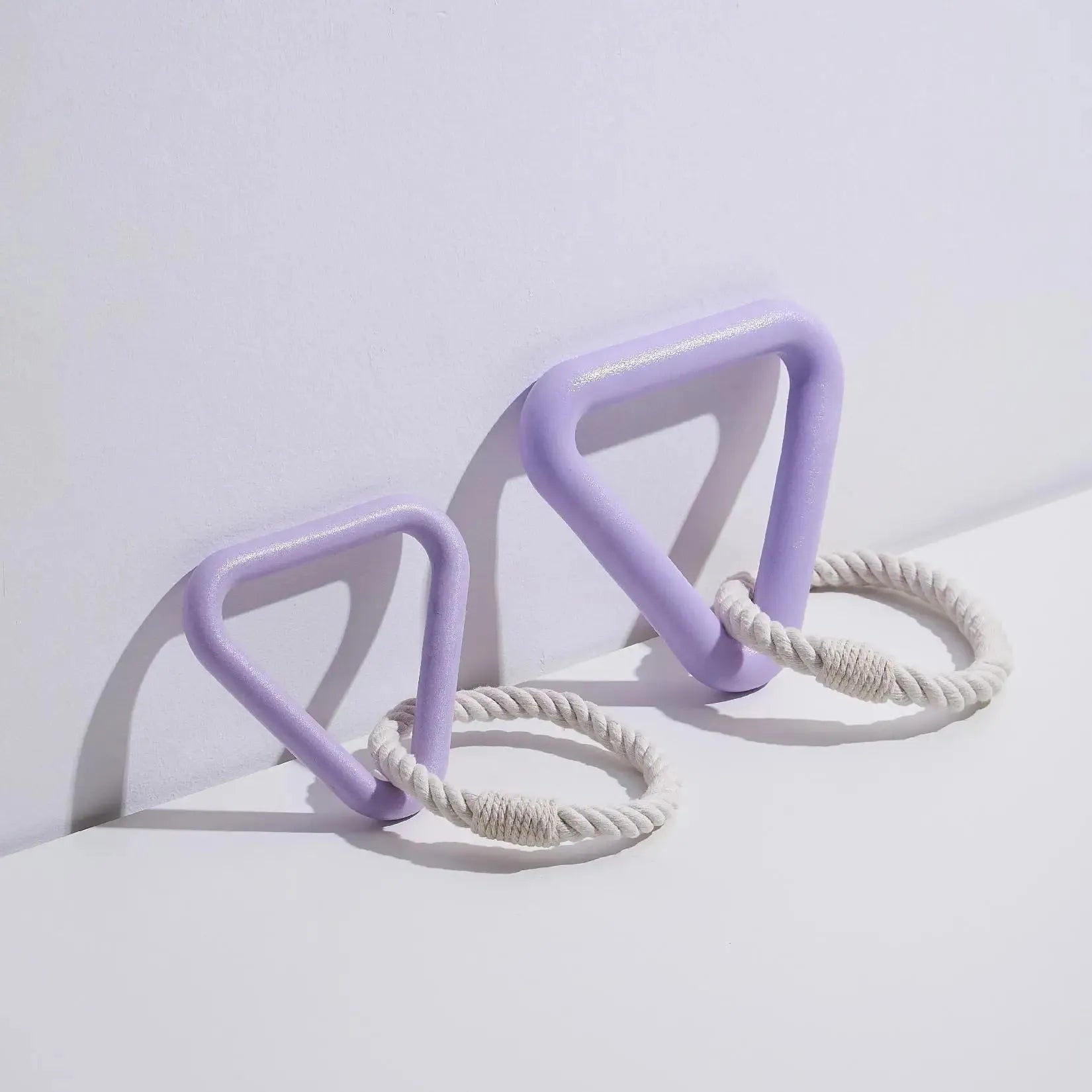 Large triangular pull ring dog toy with twisted cotton rope in beige, pink, or purple.