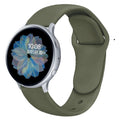 Samsung Galaxy Active 2 watch with a purple reverse buckle silicone strap on a wrist.