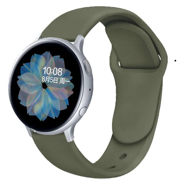 Samsung Galaxy Active 2 watch with a purple reverse buckle silicone strap on a wrist.