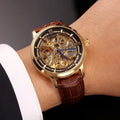 Men's automatic mechanical watch with leather hollow strap and waterproof design, casual style