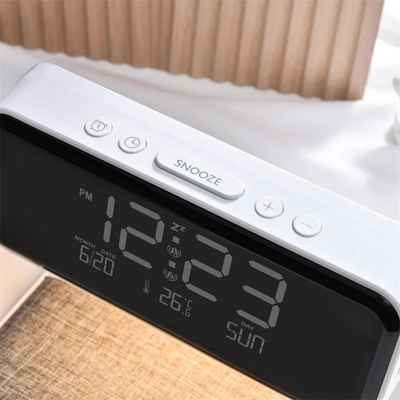 White bedside lamp with wireless charging pad and LCD clock display on base