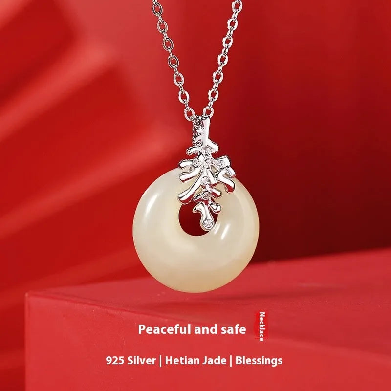Chinese style wheat necklace with 925 silver chain and jade-inlaid pendant on white background