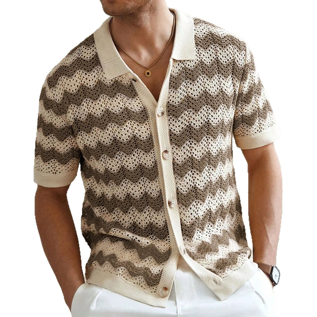 Man wearing a blue short-sleeve sweater with a textured jacquard knit pattern.