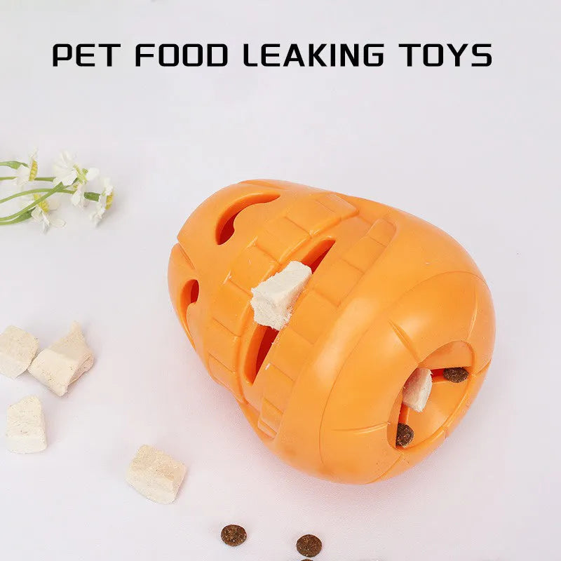 Orange Halloween pumpkin shaped dog chew toy with a black treat-dispensing funnel on top.