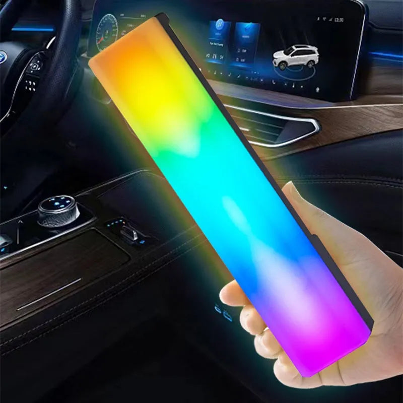 3D RGB voice-activated table lamp with colourful lights on a desk, showing white shell option.
