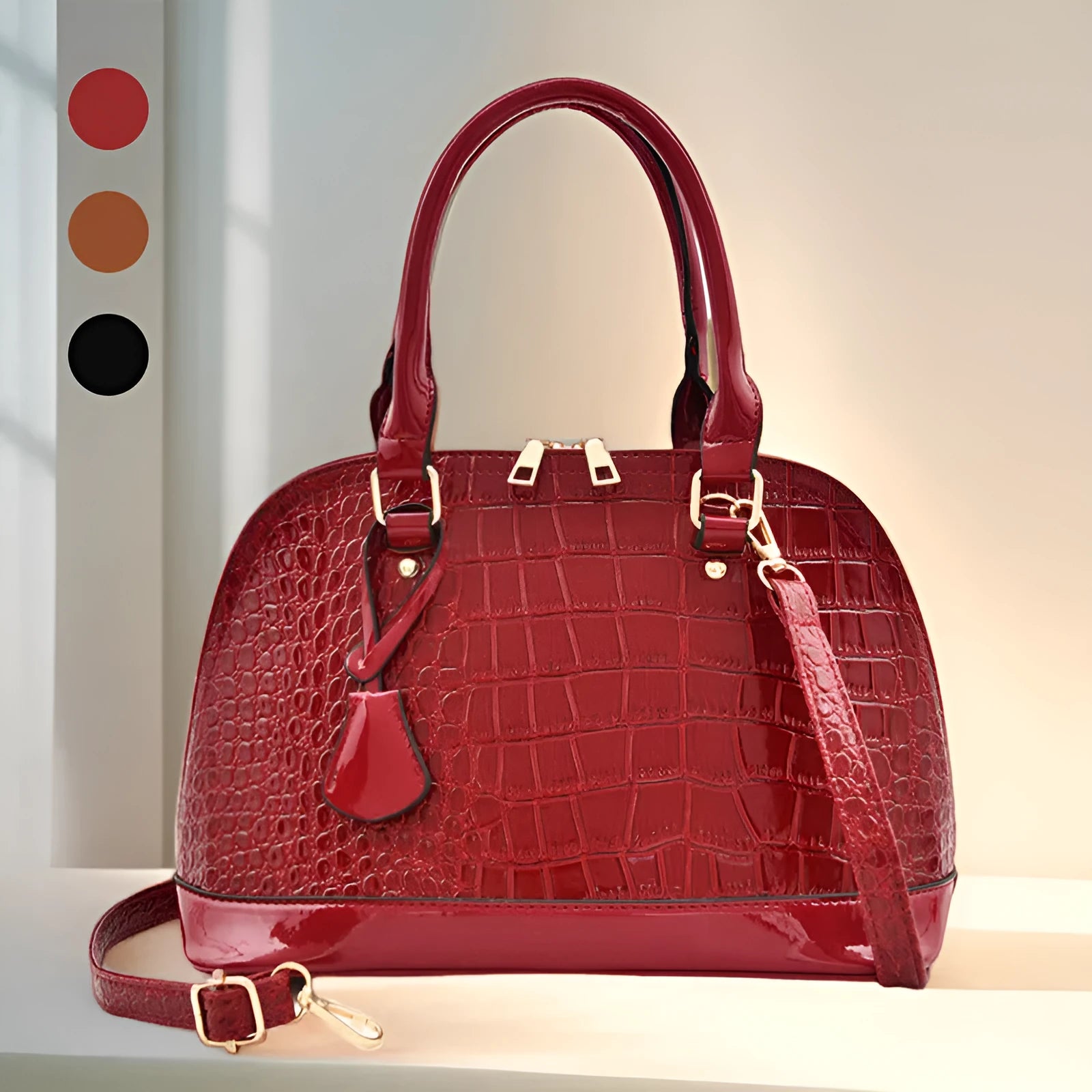 Women's large shiny PU leather crossbody shoulder bag in shell shape, shown in black colour.