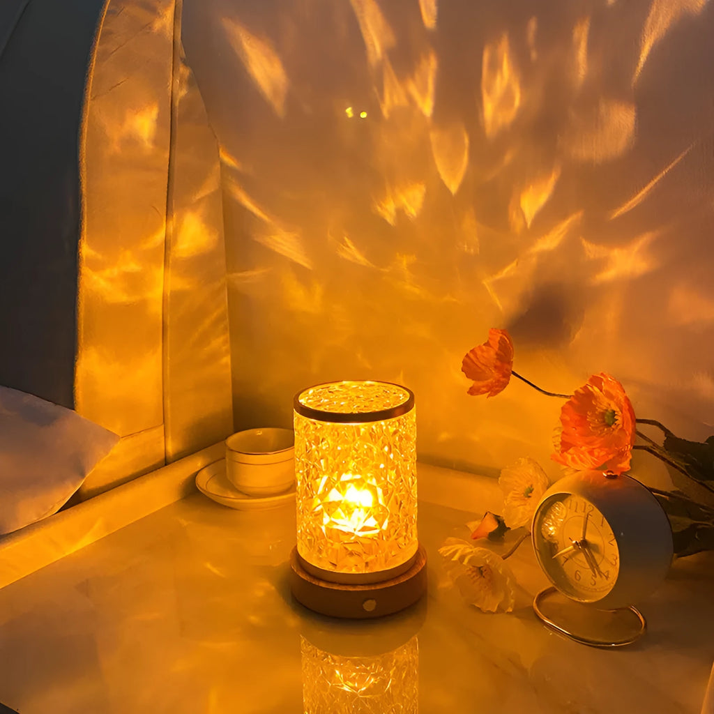 Rotating water ripple effect small night light with acrylic shade on a solid wood base.