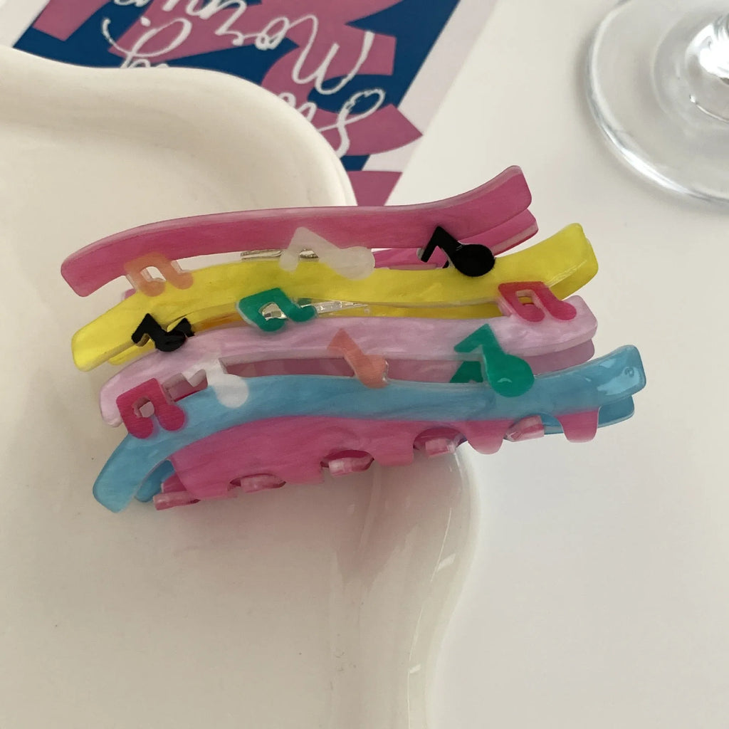 Acrylic candy color wave mixed colour notes hair grip with irregular shape on a background
