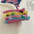 Acrylic candy color wave mixed colour notes hair grip with irregular shape on a background