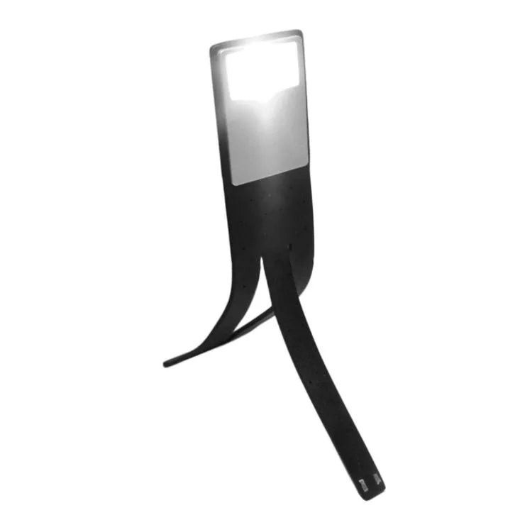 Black folding LED reading lamp showing compact folded design with USB charging port