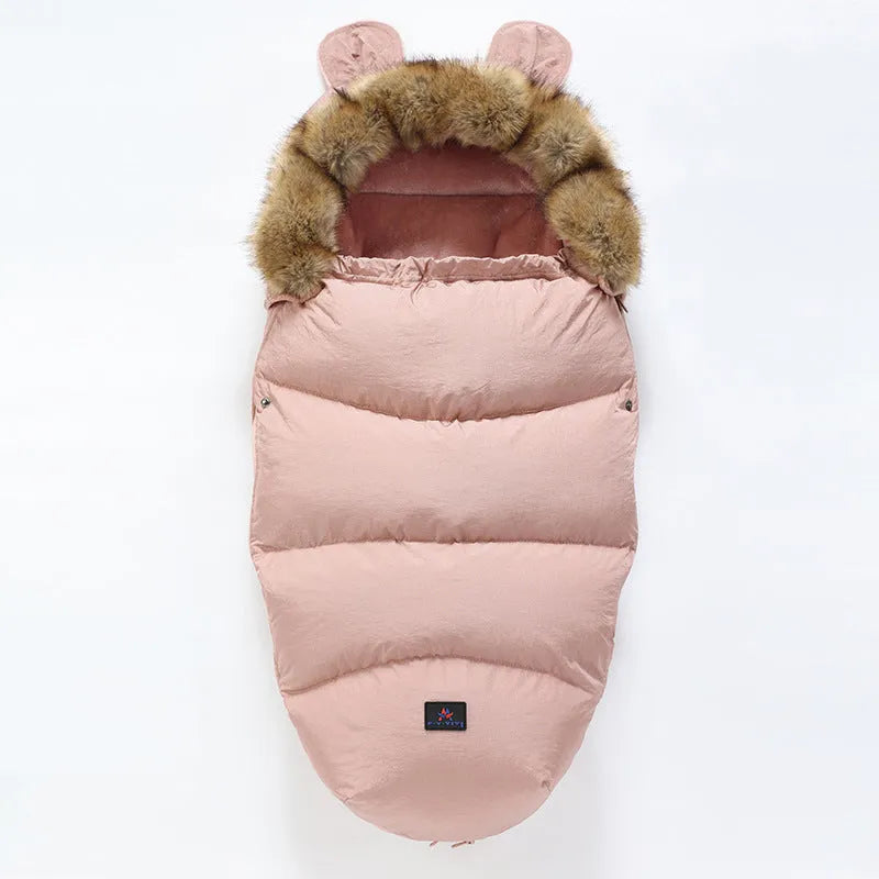 Baby warm cocoon style sleeping bag on a neutral background demonstrating solid colour design with zip closure