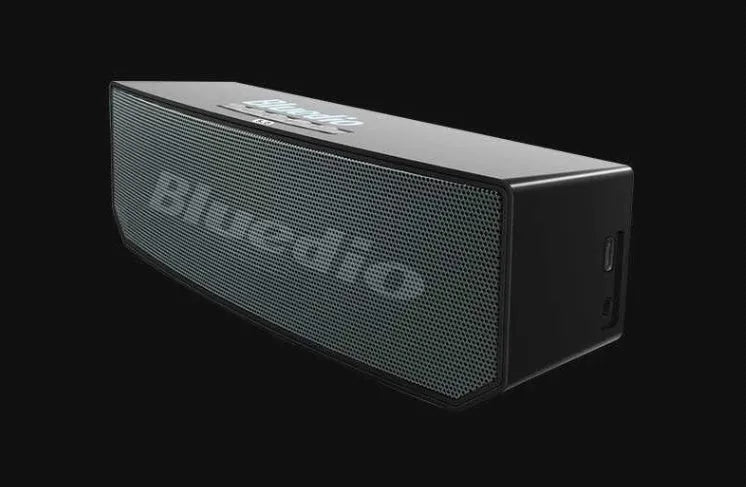 Black BS-6 cloud smart speaker showing front grill and compact rectangular body.