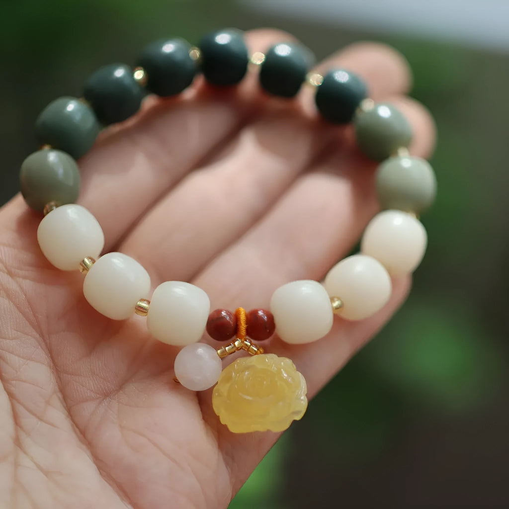 Bodhi root bracelet with gradient white jade and beeswax lotus pendants