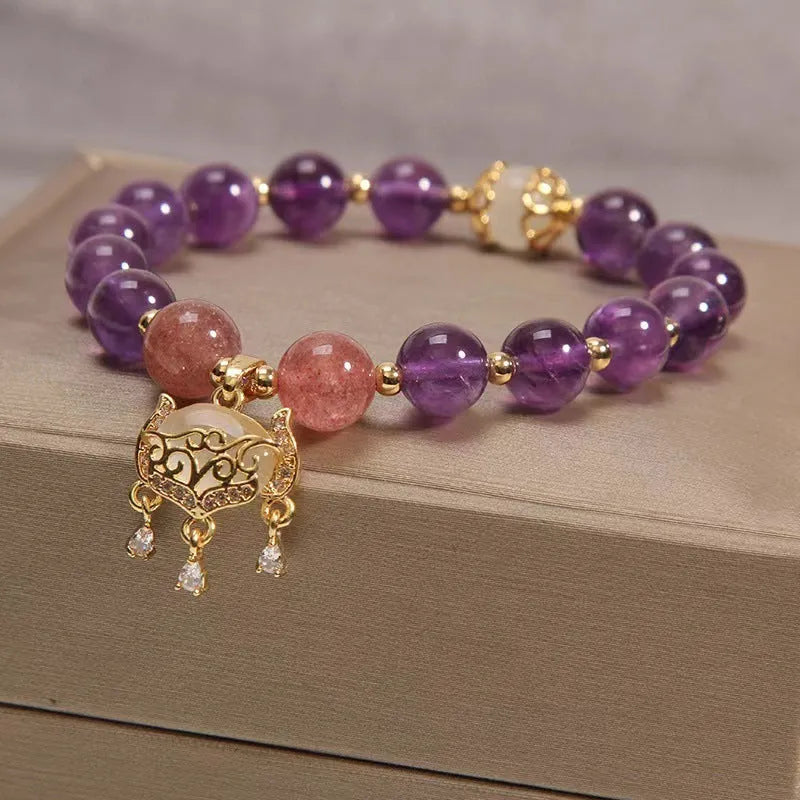 Women's copper bracelet with natural amethyst gemstones and drop-shaped longevity lock charm