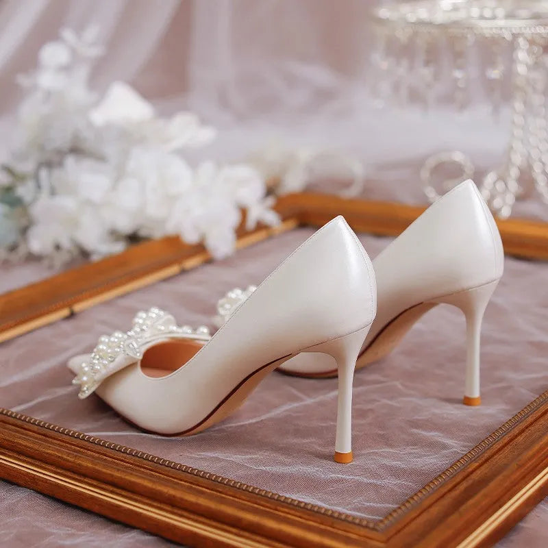Women's stiletto heel bride wedding dress shoes in milky white with pointed toe and low top