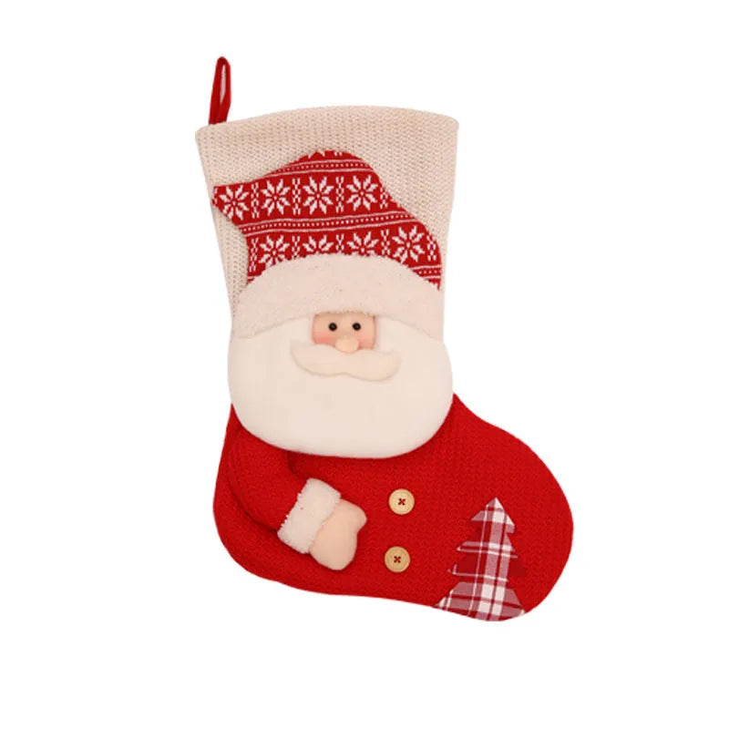 Large red and white knitted Christmas stocking with Santa Claus or Snowman design on a fireplace mantel