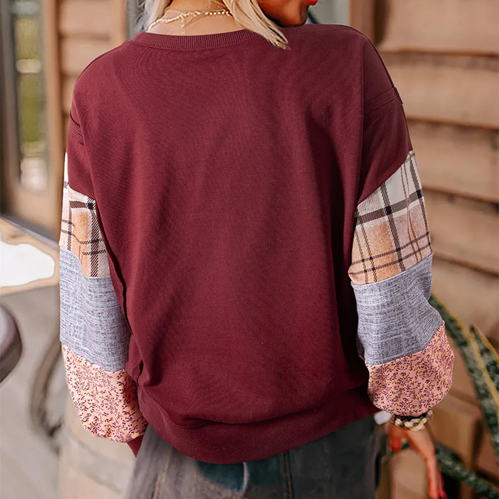 Women's loose fit apricot plaid stitch long sleeve pullover top on hanger.