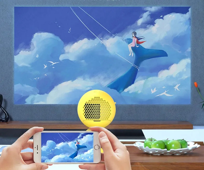 YG220 white or yellow LED projector showing front projection design and compact 0.7kg build